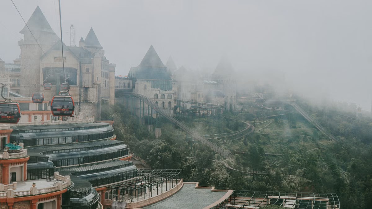 Capture of iconic French village in Ba Na Hills, Vietnam enveloped in mist and viewed from above.